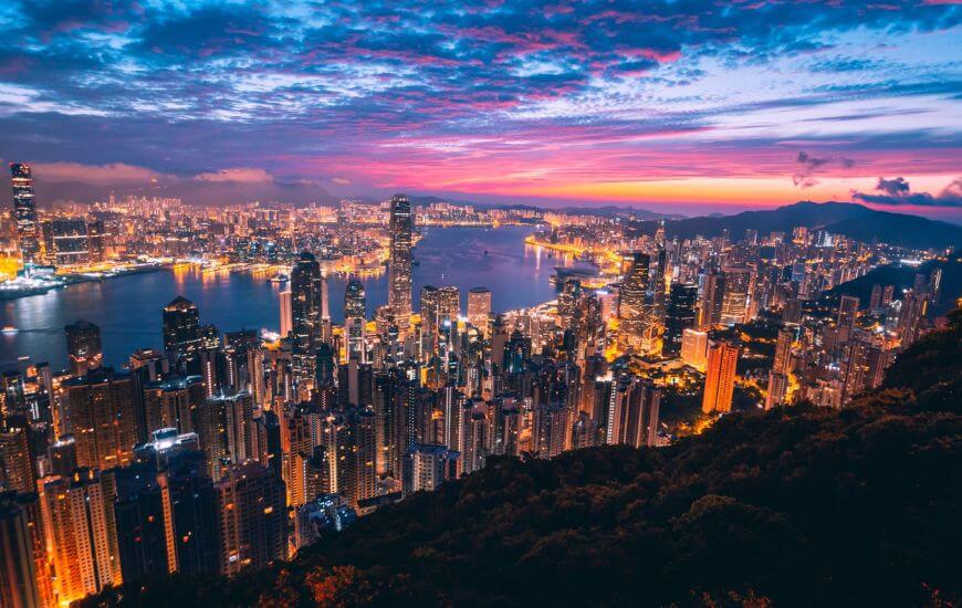 hong kong skyline over during sunset - working holidays for brits destination