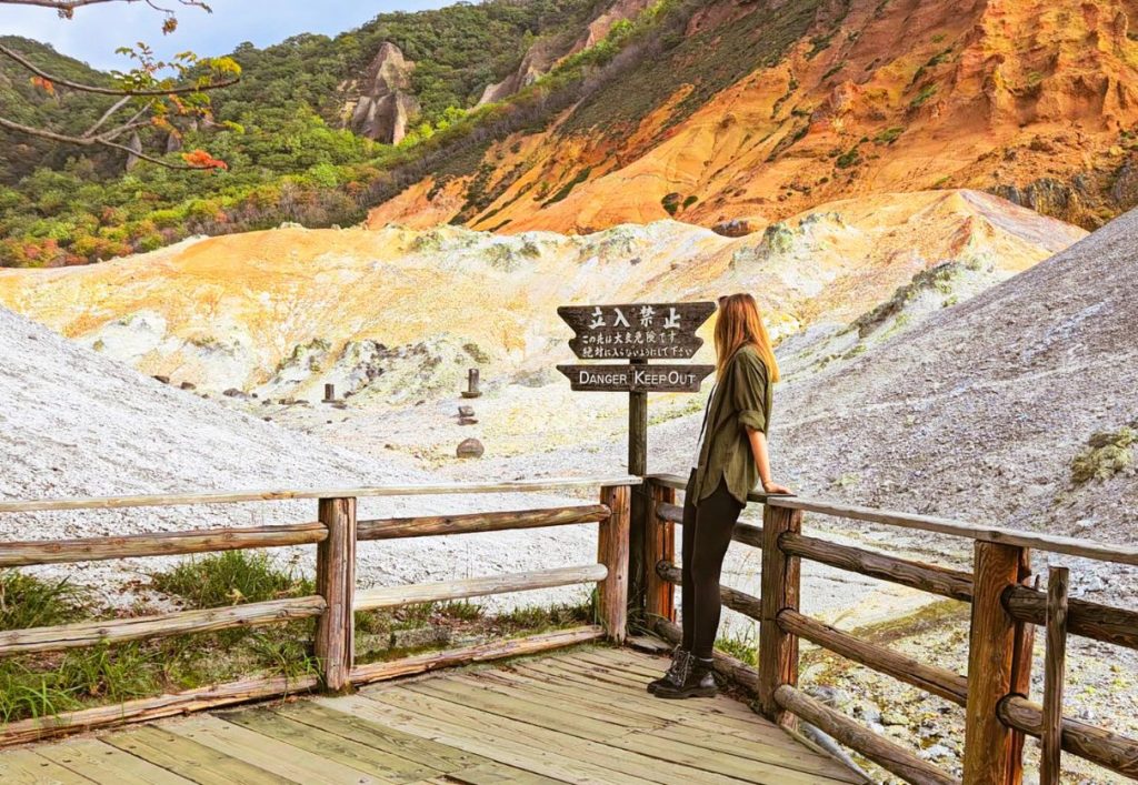 me standing at the base of hell valley volcanic zone in Noboribetsu  - day trips from sapporo