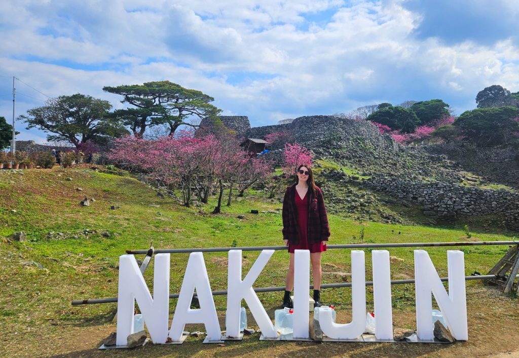Me standing by the Nakijin sign on the edge of the castle grounds